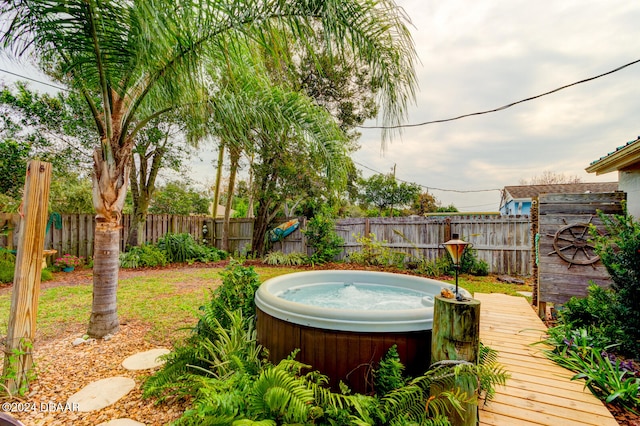 exterior space with a hot tub