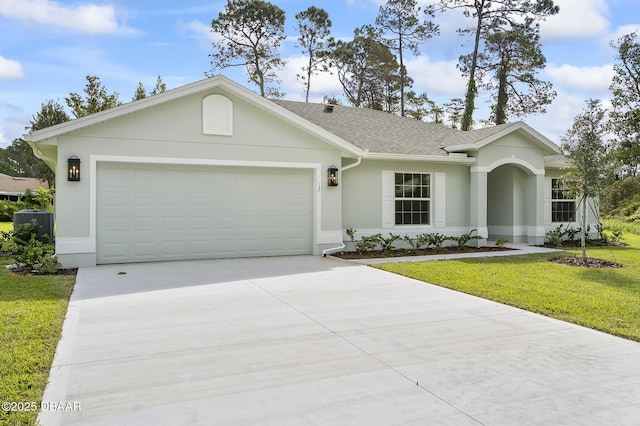 ranch-style house featuring a front lawn and a garage