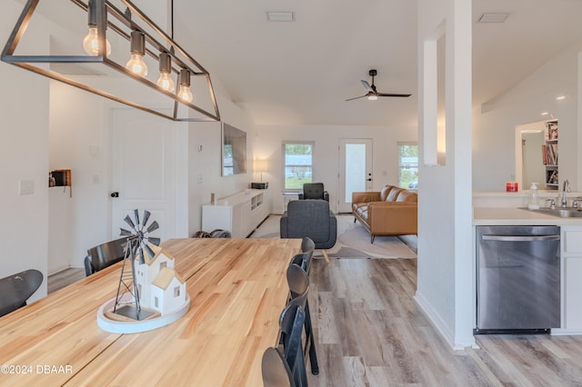 dining area featuring sink, ceiling fan, and light hardwood / wood-style flooring