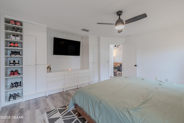 bedroom featuring ceiling fan and light hardwood / wood-style flooring