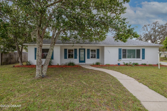 ranch-style house with a front yard