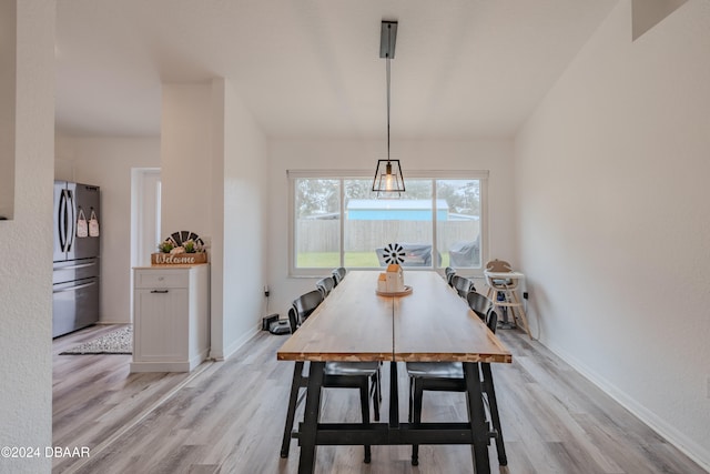 dining space with light wood-type flooring