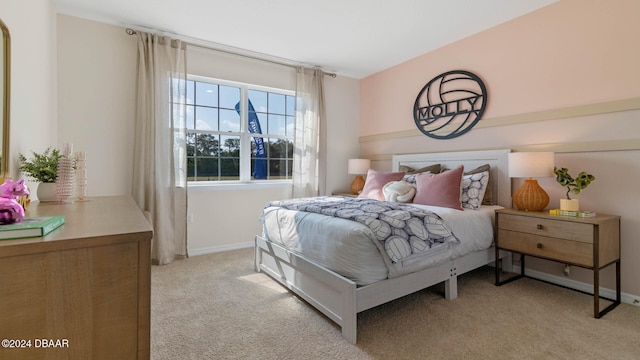 bedroom featuring light colored carpet