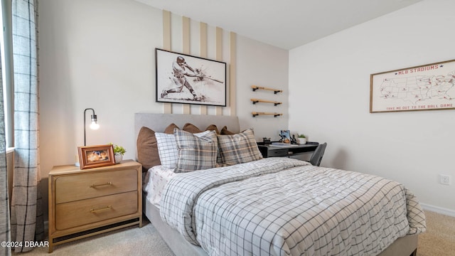 bedroom featuring light colored carpet