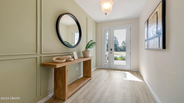 doorway with light hardwood / wood-style flooring