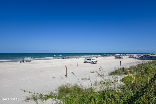 property view of water featuring a beach view