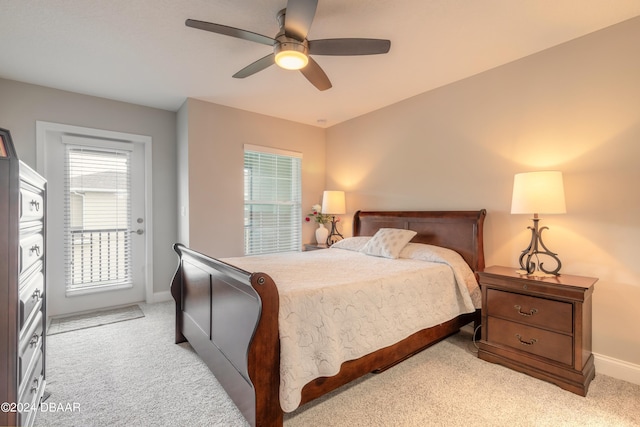 carpeted bedroom with ceiling fan and access to outside