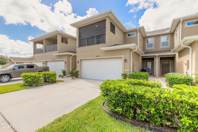 multi unit property featuring a garage