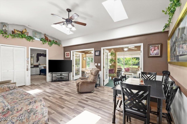 771 Arroyo Pkwy, Ormond Beach, FL 32174 - living room featuring a ceiling fan, lofted ceiling, a skylight, and wood finished floors