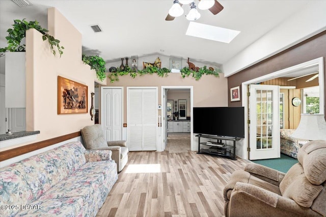771 Arroyo Pkwy, Ormond Beach, FL 32174 - living area with ceiling fan, a skylight, light wood-style floors, and lofted ceiling