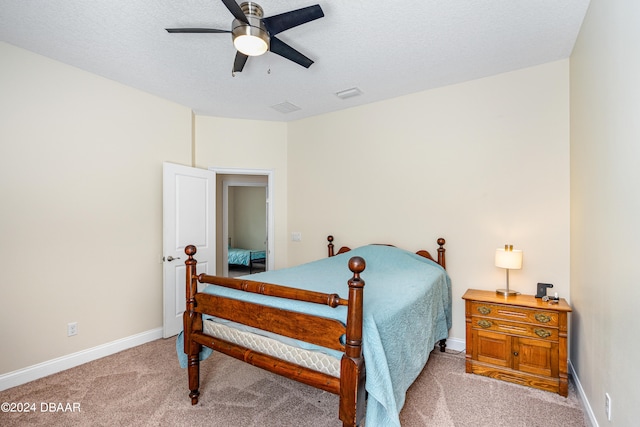 3651 Pini Ave, New Smyrna Beach, FL 32168 - carpeted bedroom featuring a textured ceiling and ceiling fan