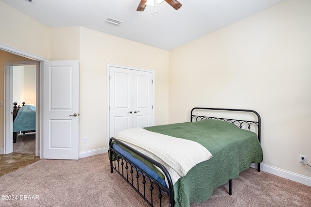 3651 Pini Ave, New Smyrna Beach, FL 32168 - bedroom featuring carpet floors, ceiling fan, and a closet