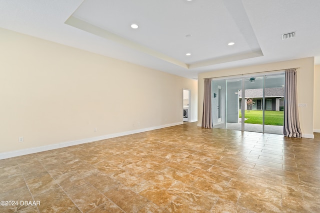 3651 Pini Ave, New Smyrna Beach, FL 32168 - spare room featuring a raised ceiling