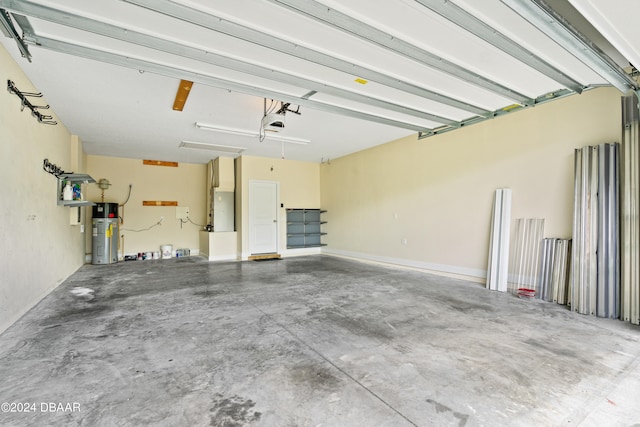 3651 Pini Ave, New Smyrna Beach, FL 32168 - garage featuring a garage door opener and water heater