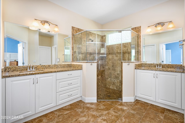 3651 Pini Ave, New Smyrna Beach, FL 32168 - bathroom featuring vanity, tile patterned floors, and a shower with shower door