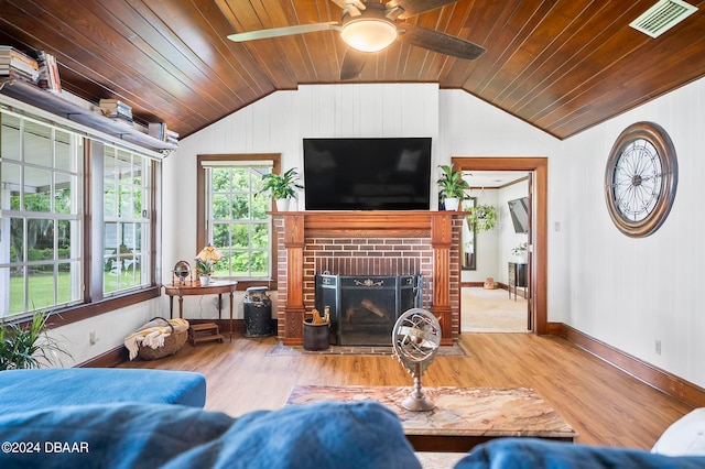 living room with wood-type flooring, a fireplace, wood ceiling, vaulted ceiling, and ceiling fan