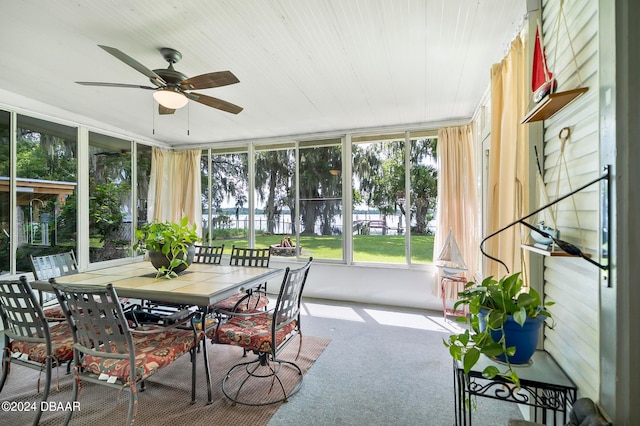 sunroom / solarium with ceiling fan