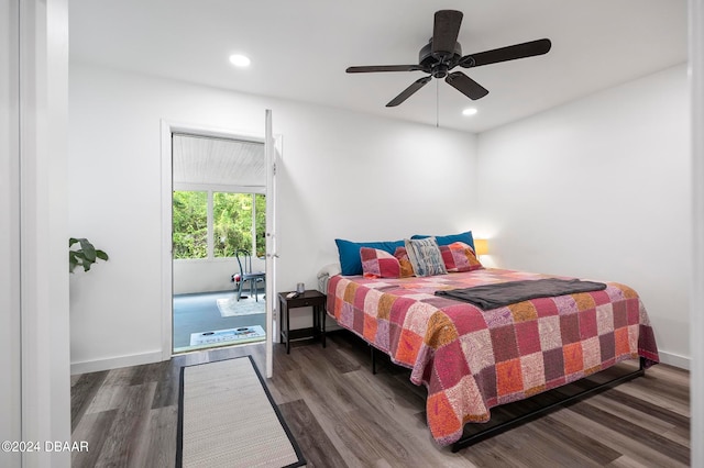 bedroom with ceiling fan and dark hardwood / wood-style floors