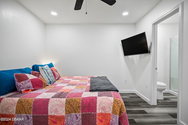 bedroom featuring ensuite bathroom, dark wood-type flooring, and ceiling fan