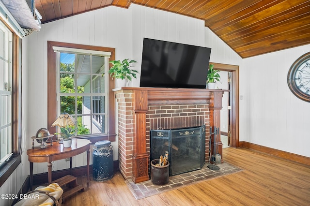 living room featuring a brick fireplace, wooden ceiling, lofted ceiling, and hardwood / wood-style floors