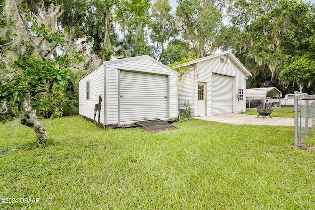 garage featuring a lawn