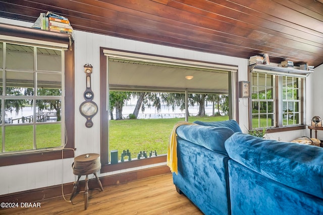 sunroom / solarium featuring wood ceiling