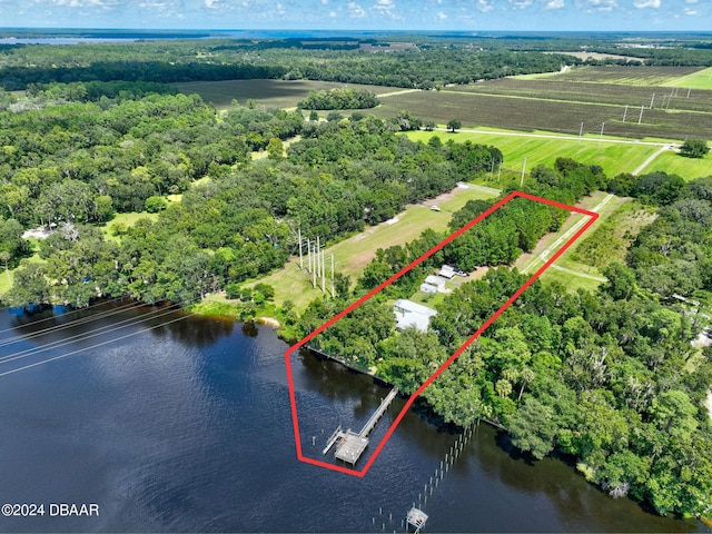 drone / aerial view featuring a rural view and a water view