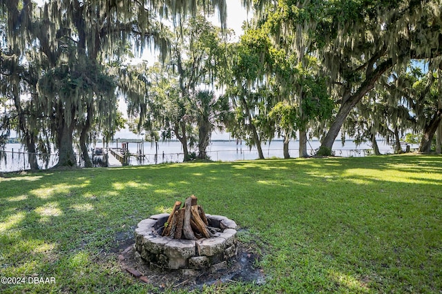 view of yard featuring an outdoor fire pit