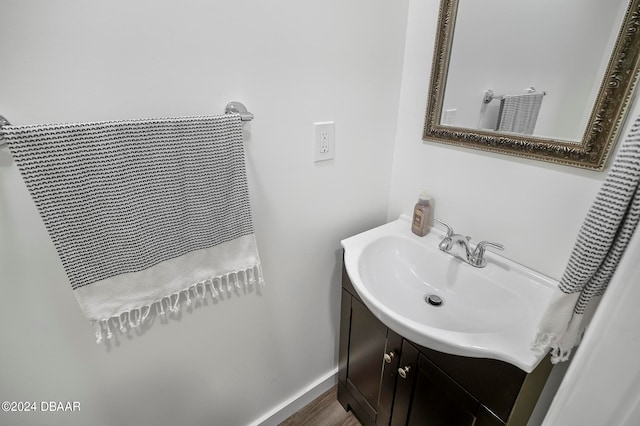 bathroom featuring hardwood / wood-style flooring and vanity