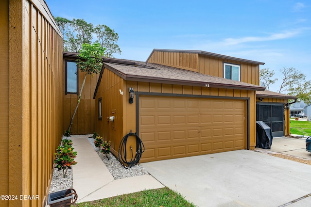 view of side of property featuring a garage