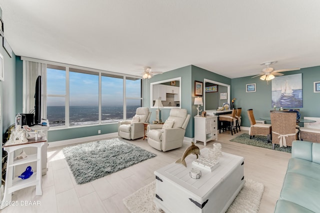2800 N Atlantic Ave Unit 515, Daytona Beach, FL 32118 - living room with ceiling fan and baseboards