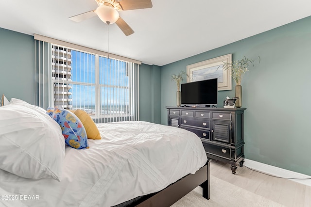 2800 N Atlantic Ave Unit 515, Daytona Beach, FL 32118 - bedroom with wood finished floors, ceiling fan, and baseboards