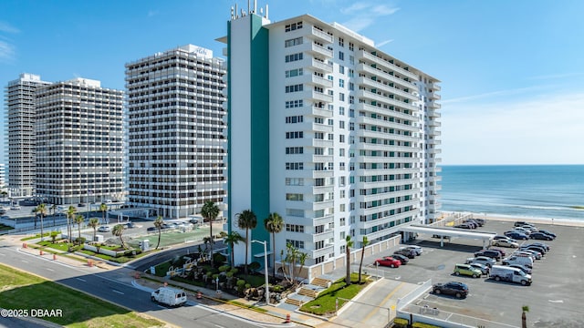 2800 N Atlantic Ave Unit 515, Daytona Beach, FL 32118 - view of property featuring uncovered parking, a water view, and a city view