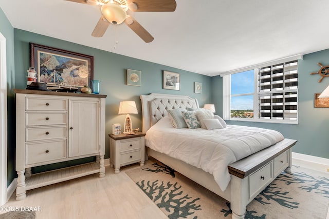 2800 N Atlantic Ave Unit 515, Daytona Beach, FL 32118 - bedroom featuring baseboards, ceiling fan, and light wood-style floors