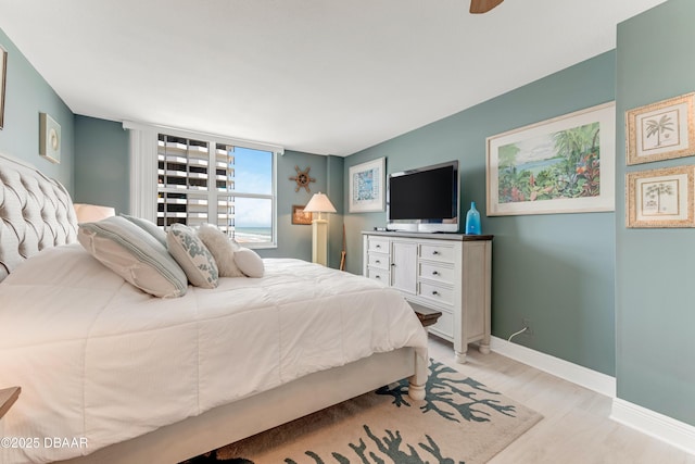 2800 N Atlantic Ave Unit 515, Daytona Beach, FL 32118 - bedroom featuring baseboards and light wood-style floors