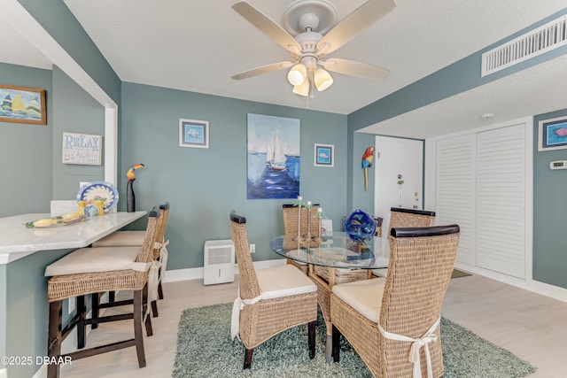 2800 N Atlantic Ave Unit 515, Daytona Beach, FL 32118 - dining space featuring light wood finished floors, baseboards, and a ceiling fan