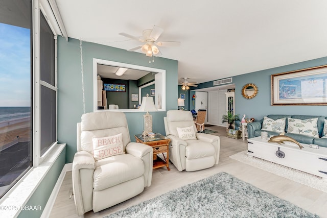 2800 N Atlantic Ave Unit 515, Daytona Beach, FL 32118 - living area with a ceiling fan and wood finished floors