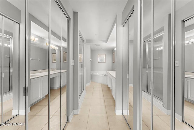 3425 S Atlantic Ave Unit 902, Daytona Beach Shores, FL 32118 - hall featuring light tile patterned floors and baseboards
