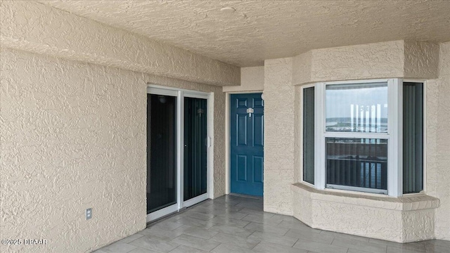 3425 S Atlantic Ave Unit 902, Daytona Beach Shores, FL 32118 - view of exterior entry with stucco siding