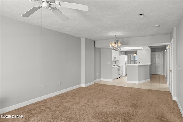 3425 S Atlantic Ave Unit 902, Daytona Beach Shores, FL 32118 - unfurnished living room with light colored carpet, a textured ceiling, a chandelier, baseboards, and light tile patterned flooring