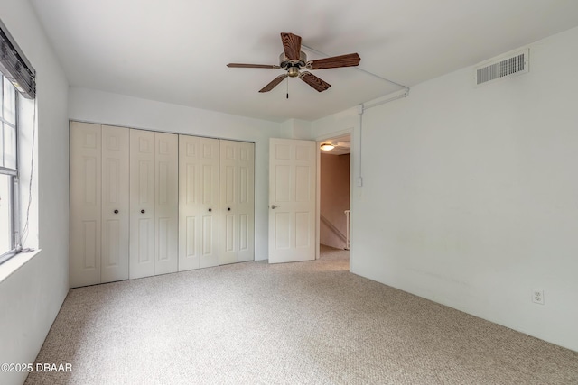 108 Mitchell Pl, Daytona Beach, FL 32118 - unfurnished bedroom featuring a closet and a ceiling fan