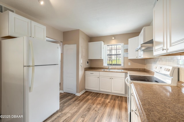 108 Mitchell Pl, Daytona Beach, FL 32118 - kitchen with white appliances, a sink, under cabinet range hood, and white cabinets