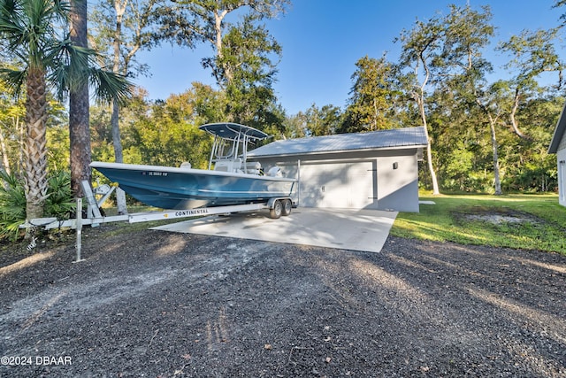 exterior space featuring a garage and a yard