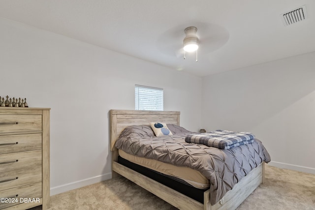 bedroom with ceiling fan and light colored carpet