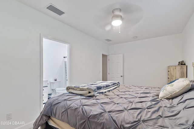 bedroom with ceiling fan and ensuite bath