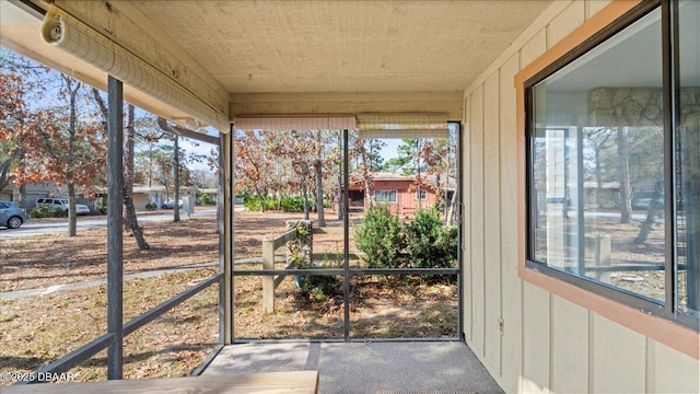 unfurnished sunroom featuring a healthy amount of sunlight