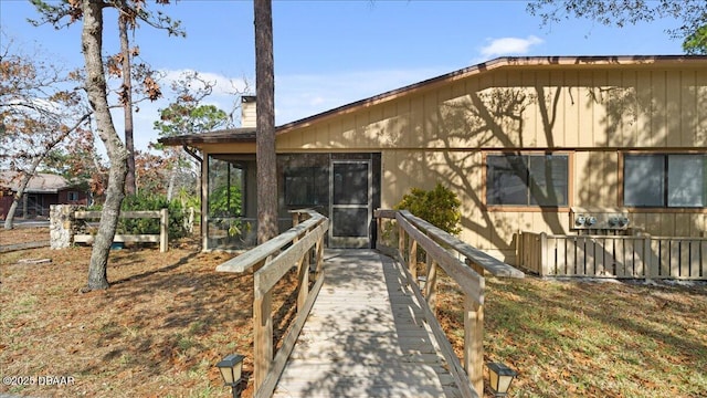 exterior space featuring a sunroom