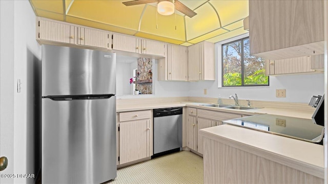 kitchen with ceiling fan, appliances with stainless steel finishes, sink, and light brown cabinets