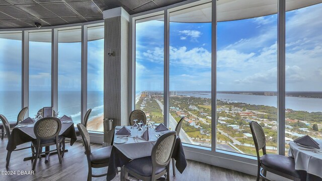 sunroom / solarium with a water view