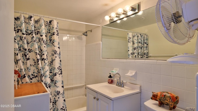 1233 S Atlantic Ave Unit 102, Daytona Beach, FL 32118 - bathroom with vanity, shower / tub combo with curtain, and tile walls